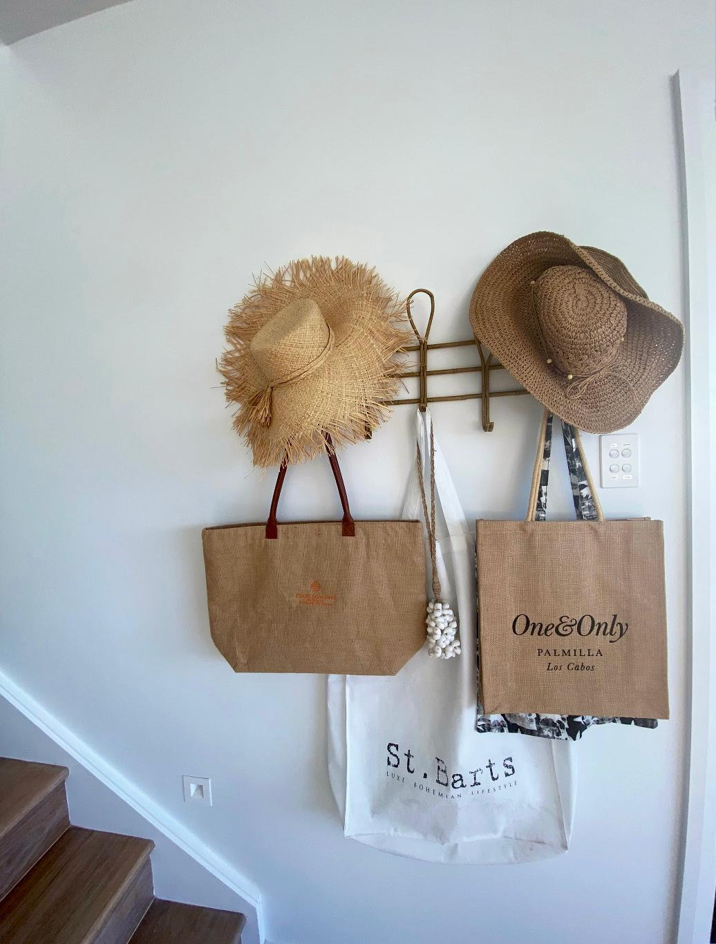 Straw hats and beach bags wall display