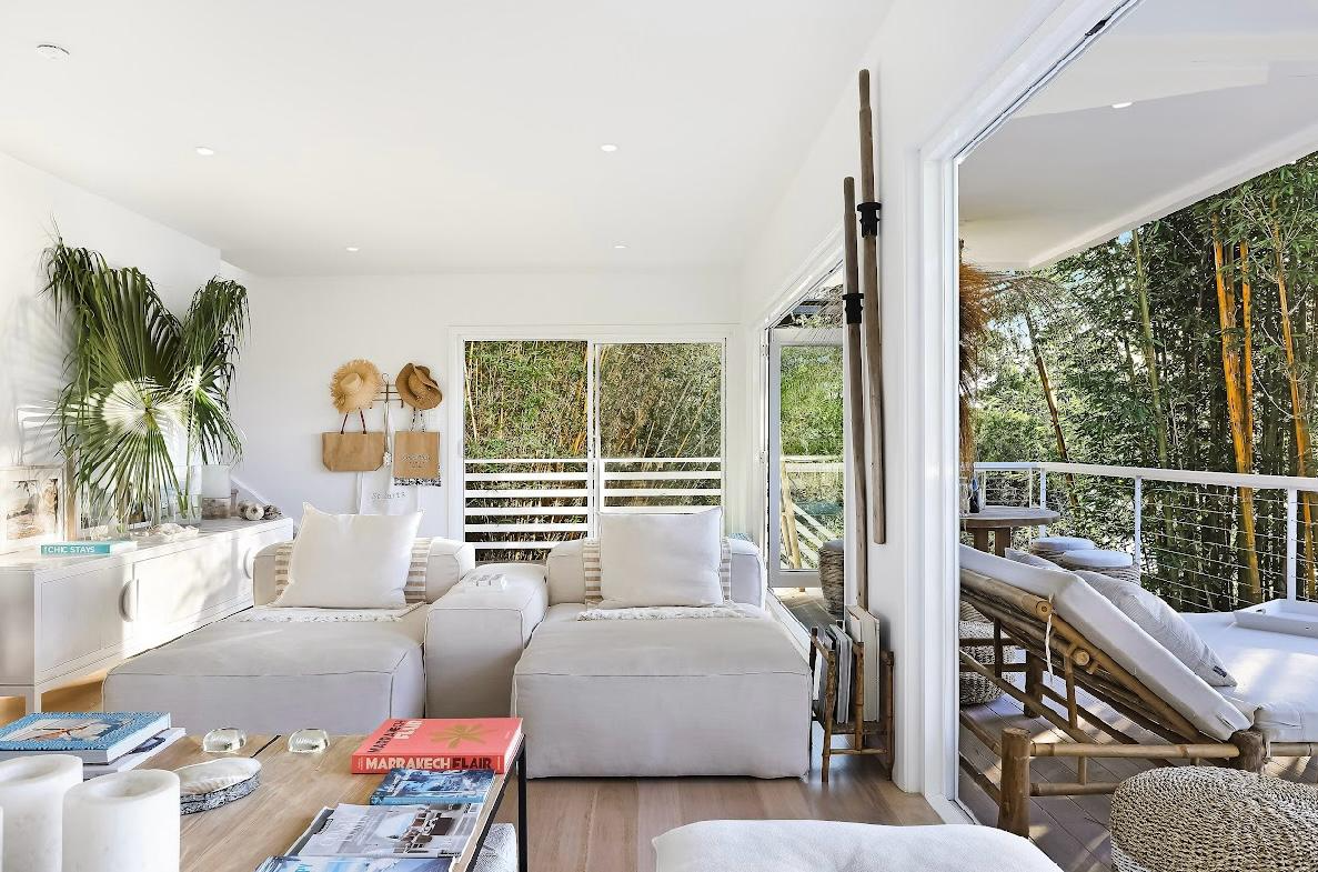 Bright coastal living room with bamboo daybed