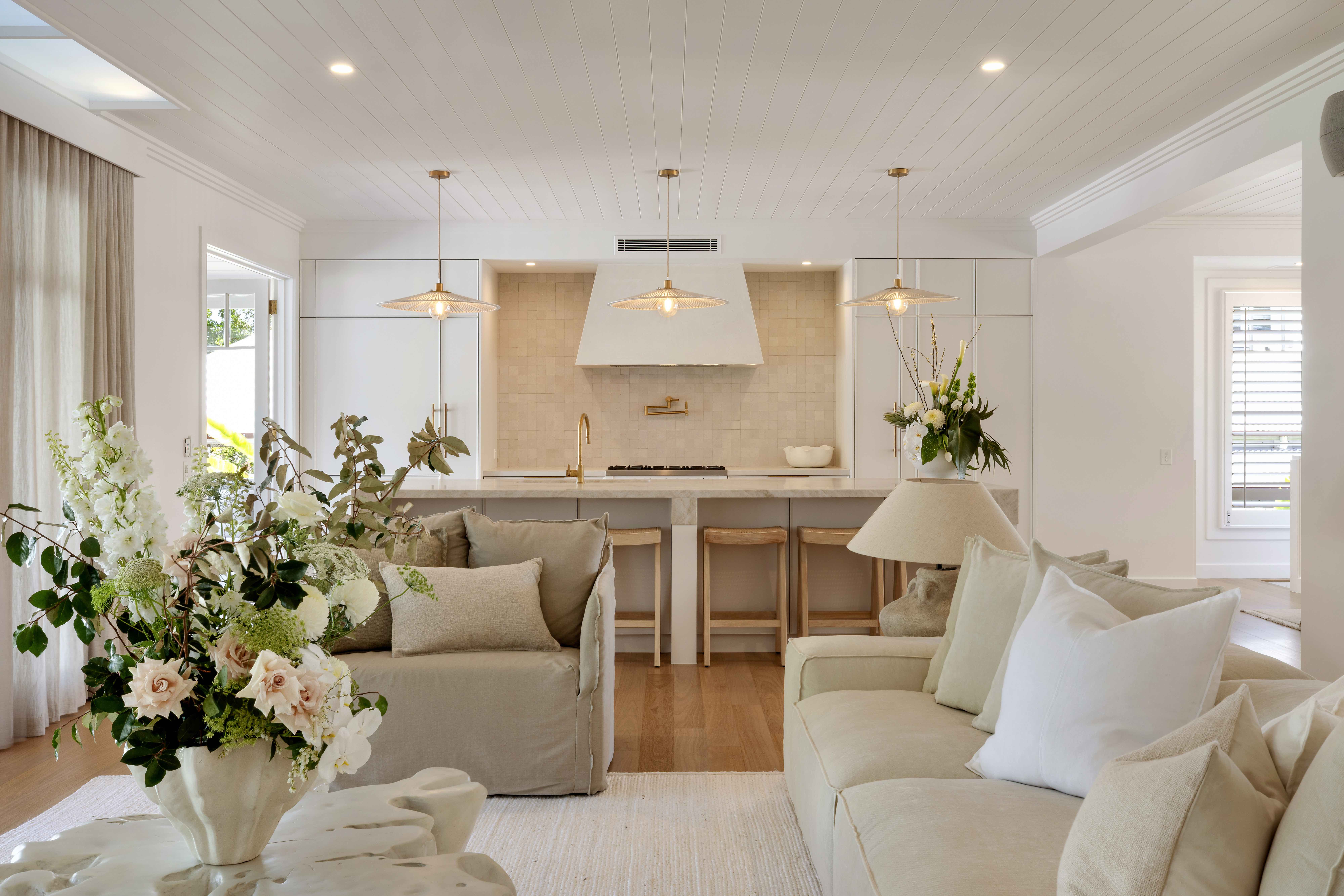 Open plan living and kitchen with pendant lights