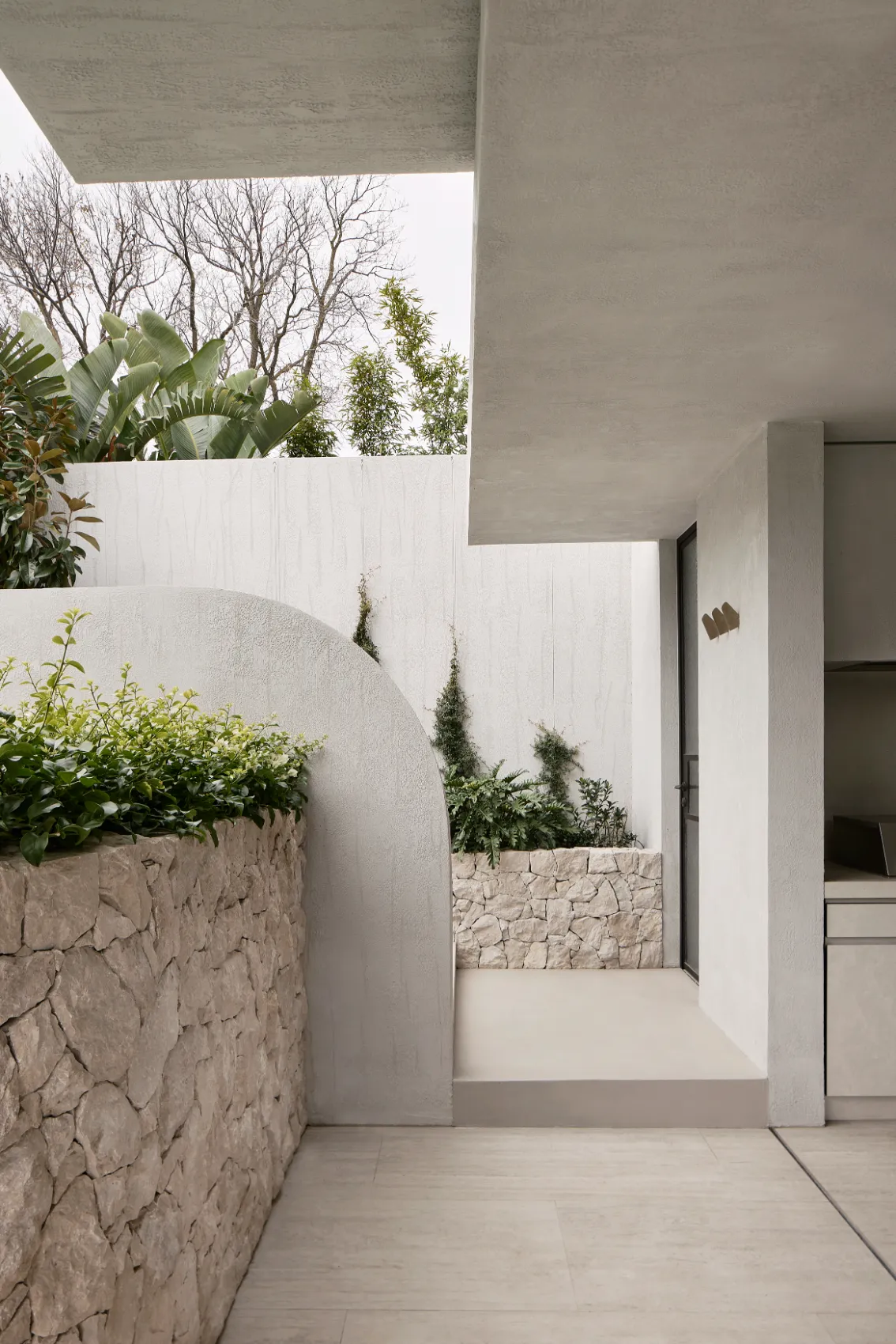 Exterior courtyard with stone planters